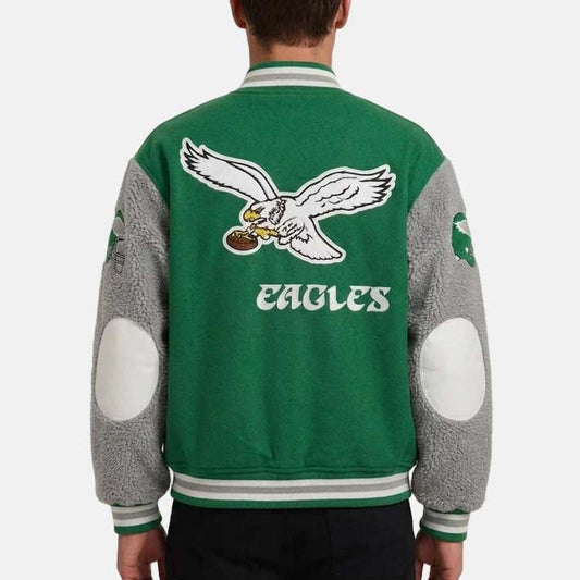 Green Philadelphia Eagles varsity bomber jacket with snap-button front and striped rib-knit trim