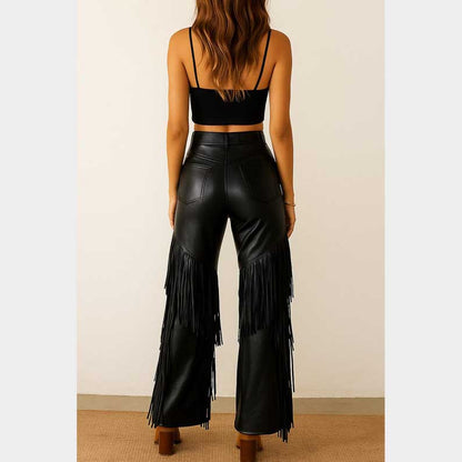Black faux leather fringe pants featuring dramatic side detailing and bell bottom design by Jackets Kingdom