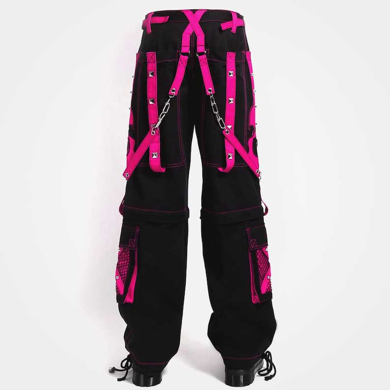 Convertible cargo pants featuring pink skull patches and strap accents by Jackets Kingdom