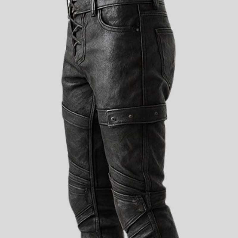 Gothic steampunk warrior pants in black leather with antique metal eyelets and straps