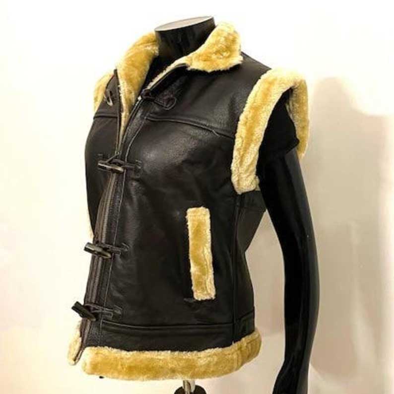 Hand-stitched women's shearling vest with toggle-button overlays and reinforced seams