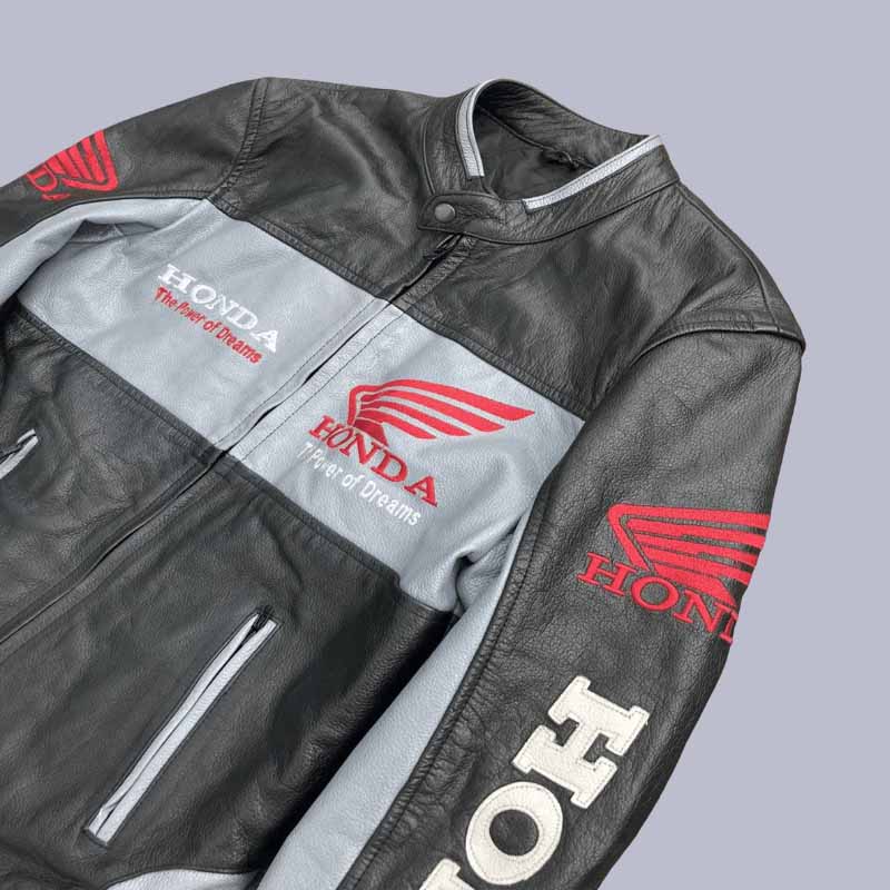Close up of embroidered Honda Power of Dreams slogan on leather jacket