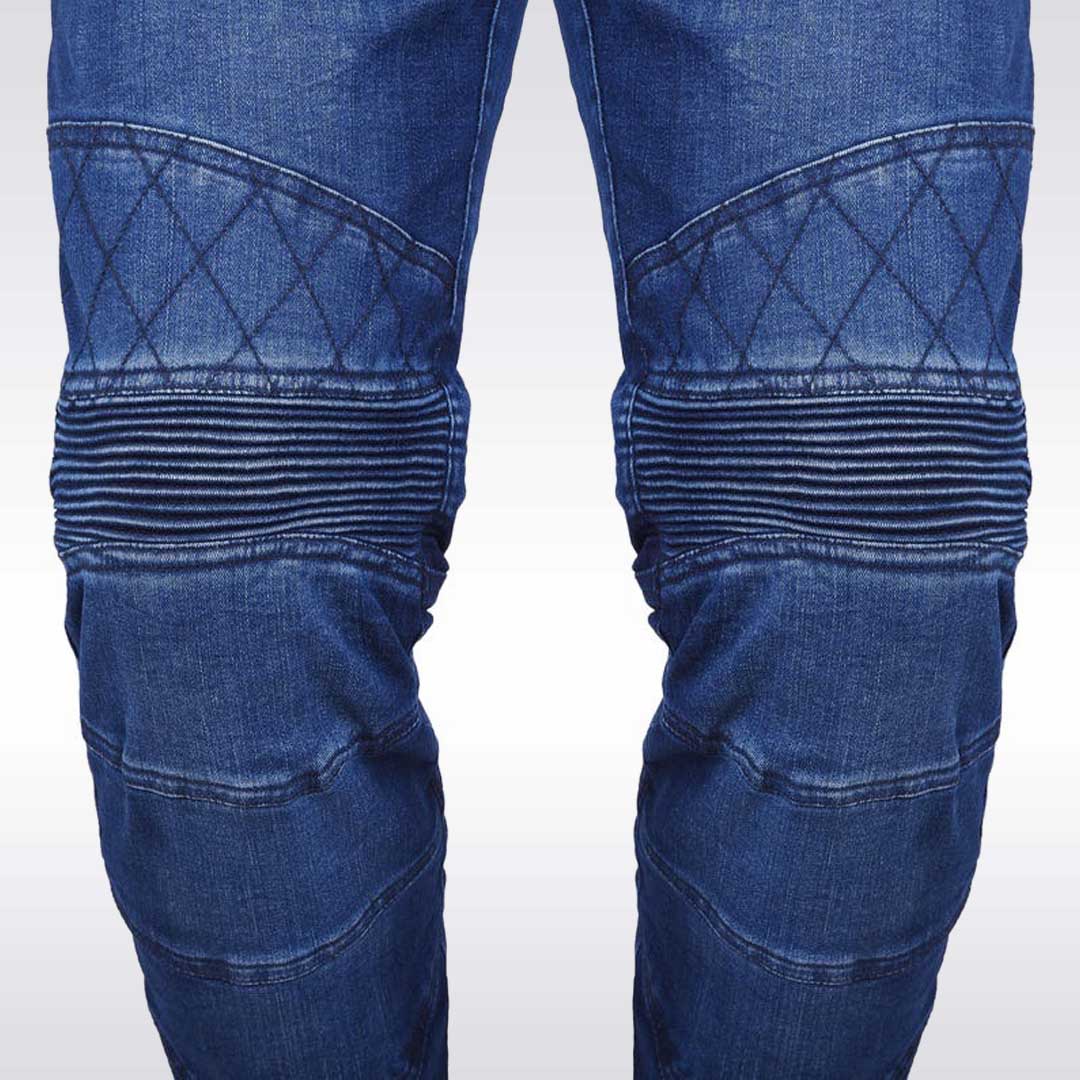 Close-up of blue jeans with quilted design