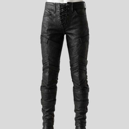 Men's handmade black leather warrior pants with crisscross lace-up front and gothic design