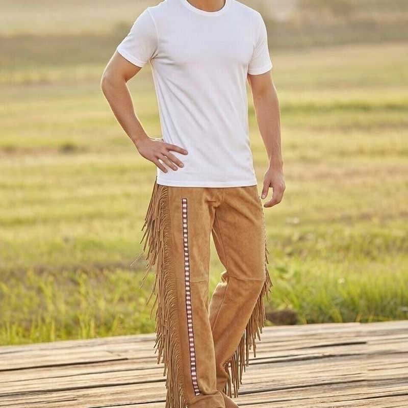 Western cowboy pants in natural tan suede with intricate beadwork and frontier style
