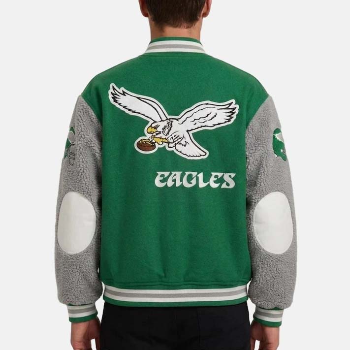 Green Philadelphia Eagles varsity bomber jacket with snap-button front and striped rib-knit trim