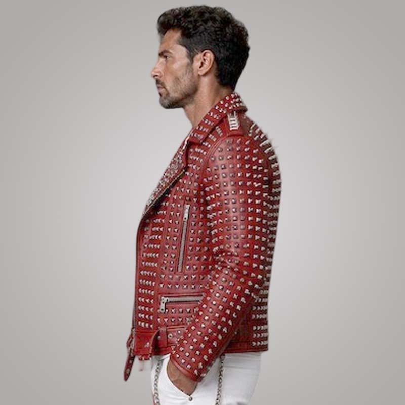 Premium red genuine leather jacket with fitted biker silhouette and silver metal spikes.